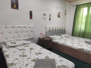 Postel nebo postele na pokoji v ubytování Shamus Javed Homestay + 37 fotografií