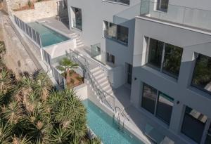 an aerial view of a building with a swimming pool at ArtCotel Luxury Villa in Rethymno Town