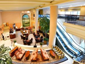 an image of a lobby with an escalator at ANA Crowne Plaza Chiryu by IHG in Chiryu