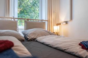 Postel nebo postele na pokoji v ubytování Ferienwohnung am Ostufer