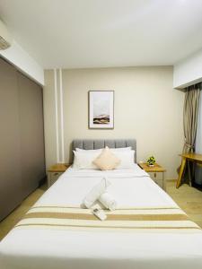 Postel nebo postele na pokoji v ubytování Eaton Service Apartment at KLCC