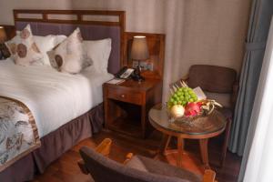 Postel nebo postele na pokoji v ubytování Canvas Sapa Legend Hotel