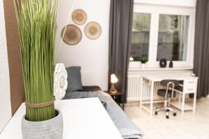 a living room with a couch and a table at CosyHomes24 - Centrally with parking space - HA01 in Hagen