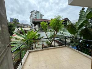 a balcony with a view of a building at Family fun 2 BHK spacious house in Trivandrum