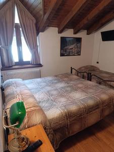 Postel nebo postele na pokoji v ubytování Garnì Bonsai