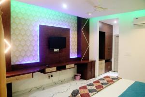 A television and/or entertainment centre at RBS Hotel & Restaurant 5 mint walking distance from Ram Janam Bhumi