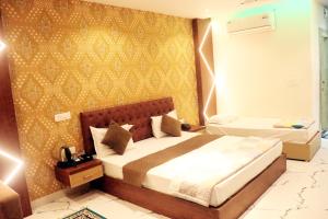 A bed or beds in a room at RBS Hotel & Restaurant 5 mint walking distance from Ram Janam Bhumi