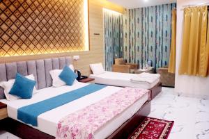 A bed or beds in a room at RBS Hotel & Restaurant 5 mint walking distance from Ram Janam Bhumi