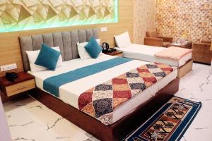 A bed or beds in a room at RBS Hotel & Restaurant 5 mint walking distance from Ram Janam Bhumi