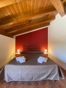 Postel nebo postele na pokoji v ubytování Foresteria dell'Errante