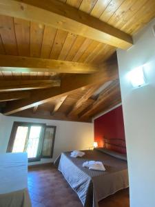 Postel nebo postele na pokoji v ubytování Foresteria dell'Errante