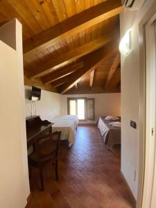Postel nebo postele na pokoji v ubytování Foresteria dell'Errante
