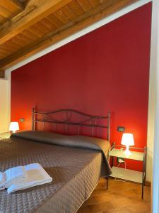 Postel nebo postele na pokoji v ubytování Foresteria dell'Errante
