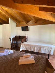 Postel nebo postele na pokoji v ubytování Foresteria dell'Errante