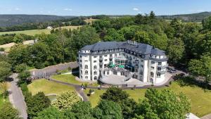 an aerial view of a large white building at Parkhotel Hachenburg in Hachenburg
