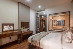 Postel nebo postele na pokoji v ubytování Canvas Sapa Legend Hotel