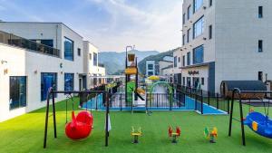 a playground in a building with a play area at Gapyeong King Kong Kids Pool Villa B in Homyŏng-ni +24 photos