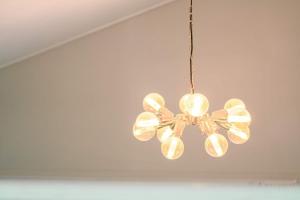 a chandelier hanging from a ceiling in a room at Gangneung Dawon Forest Private Pension in Gangneung