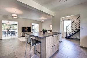 a kitchen with a large island in the middle of a room at Mas des Comtes de Provence in Tarascon