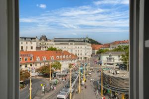 a view of a street in a city with buildings at Emerald Design - Historic City Center with Free Parking & Panoramic View by HERO HOMES in Graz