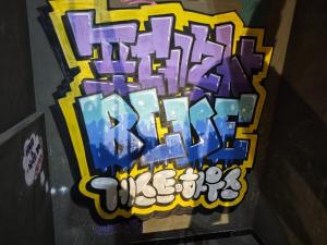 a box with some graffiti on the side of a wall at Pohang Poderosa Blue Guesthouse in Pohang