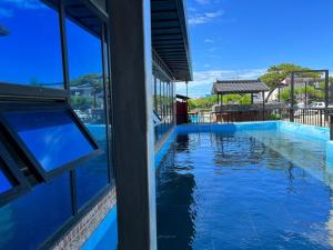 a view of a swimming pool from a building at Nonsan Oyeo Poolvilla in Nonsan +22 photos