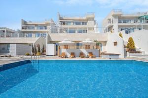 a large swimming pool in front of a building at Namhae Stay Gaeen in Namhae