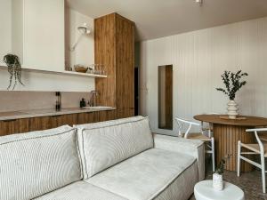 a living room with a couch and a table at Apartament Lipowa Centrum in Białystok