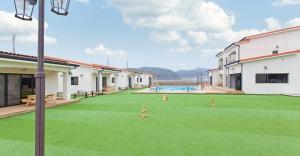a large yard with a pool in a building at The Stay Gold Dog in Taean