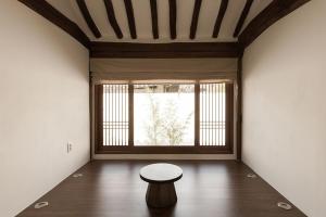a room with a table and a large window at Jeonju Leisure in Jeonju