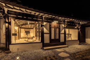 a building with a window with a chair in it at Jeonju Leisure in Jeonju +2 photos