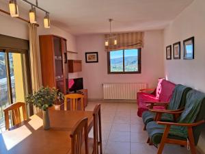 a living room with a couch and a table at Apartamentos Miguel Angel in Beteta