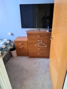 a dresser with a television on top of it at Nicks place in Peterborough