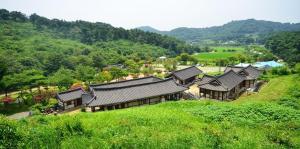 an overhead view of a house in a hill at Seocheon Munmun Traditional Hotel in Seocheon