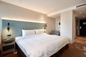 Postel nebo postele na pokoji v ubytování K Hotel Taipei II