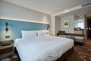 Postel nebo postele na pokoji v ubytování K Hotel Taipei II