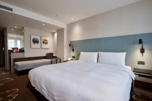 Postel nebo postele na pokoji v ubytování K Hotel Taipei II