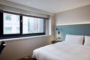 Postel nebo postele na pokoji v ubytování K Hotel Taipei II