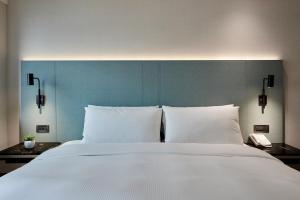 Postel nebo postele na pokoji v ubytování K Hotel Taipei II