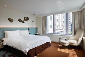 Postel nebo postele na pokoji v ubytování K Hotel Taipei II