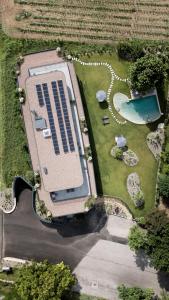 an overhead view of a building with a swimming pool at Belia Lofts - ADULTS ONLY - Apartments in Appiano sulla Strada del Vino