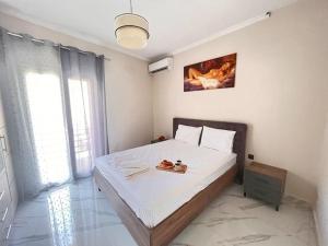 Postel nebo postele na pokoji v ubytování Metropolitan Corfu