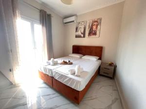 Postel nebo postele na pokoji v ubytování Metropolitan Corfu