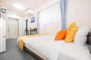 Giường trong phòng chung tại KYARA HOTEL 亀戸a