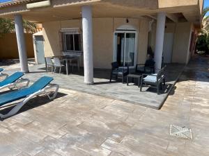 A patio or other outdoor area at CHALET CON PISCINA A 100m DE LA PLAYA LA MANGA