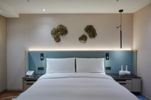 Postel nebo postele na pokoji v ubytování K Hotel Taipei II