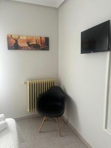 TV a/nebo společenská místnost v ubytování Hotel Juan Manuel