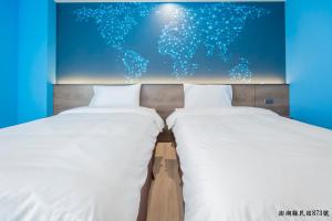 Postel nebo postele na pokoji v ubytování Tropical house Homestay