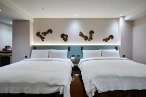 Postel nebo postele na pokoji v ubytování K Hotel Taipei II