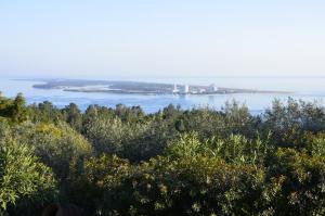 an island in the middle of a body of water at Ha Mar ao Luar in Setúbal
